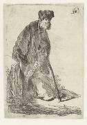 Man in a coat and fur cap leaning against a bank