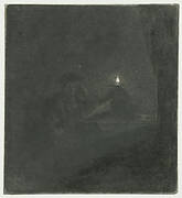 Student at a table by candlelight