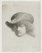 Self-portrait in a soft hat and a patterned cloak