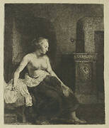 Woman sitting half dressed beside a stove