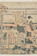 Women Hanging Laundry to Dry on a Balcony