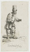 A peasant in a high cap, standing leaning on a stick